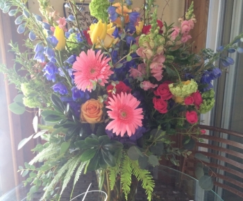Bright colored vase arrangement Minneapolis funeral