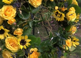Yellow sunflower funeral wreath spray