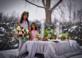 Bride and Flower Girl posing in snow Romantic Florals