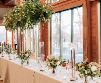 Winter Reception Headtable Centerpiece of Greenery and Candles